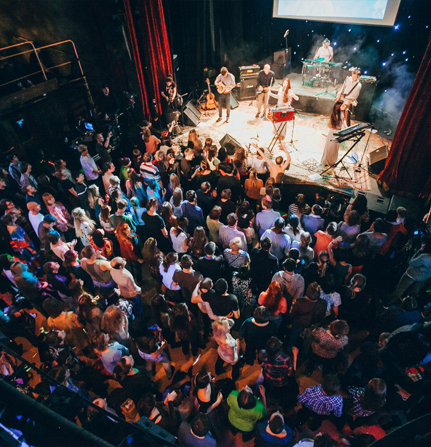 Atmasfera performance on the stage with crowd in front