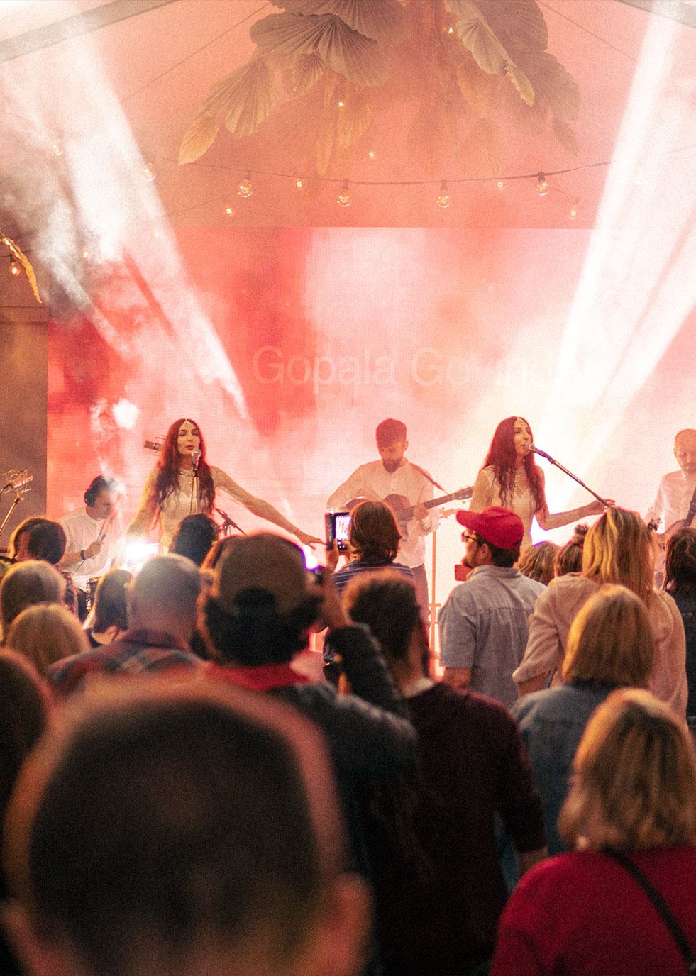 Atmasfera performance on the stage with crowd in front