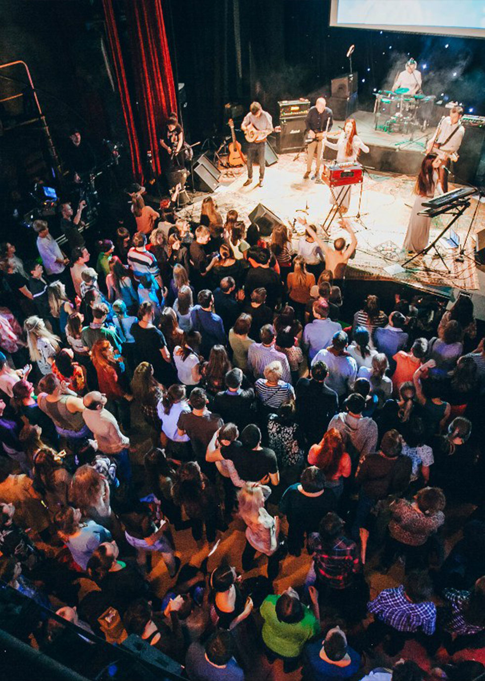 Atmasfera performance on the stage with crowd in front